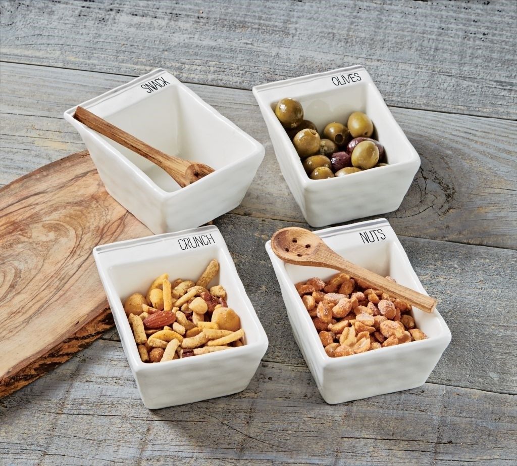 Ceramic snack dish set with "Crunch" and "Nuts" bowls, wooden spoons, and gray accent stripes Ceramic snack dish set with "Crunch" and "Nuts" bowls, wooden spoons, and gray accent stripes