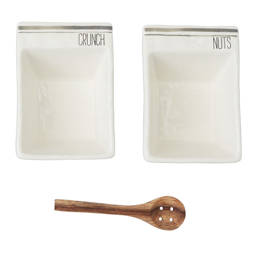 Ceramic snack dish set with "CRUNCH" and "NUTS" labels, gray accent stripes, and wooden serving spoon Ceramic snack dish set with "CRUNCH" and "NUTS" labels, gray accent stripes, and wooden serving spoon