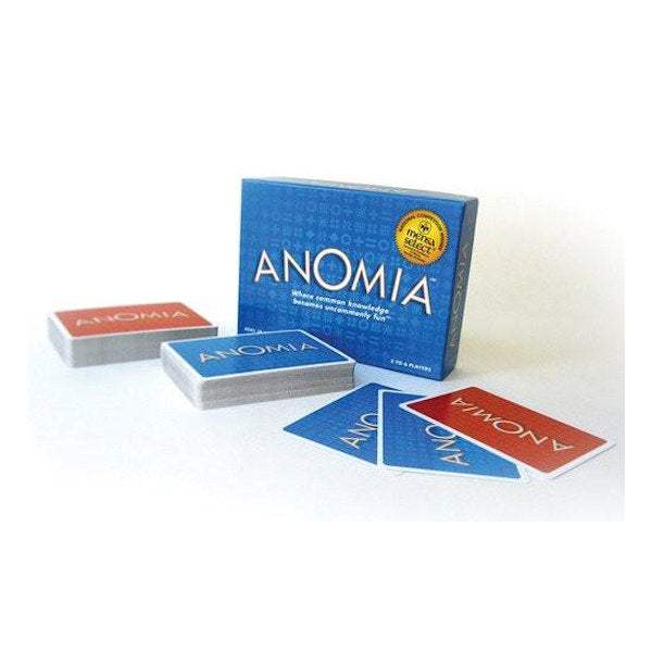 Anomia card game box and red and blue playing cards on white background Anomia card game box and red and blue playing cards on white background