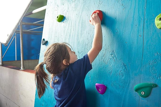 Slackers Climbing Holds Kit child  using the wall