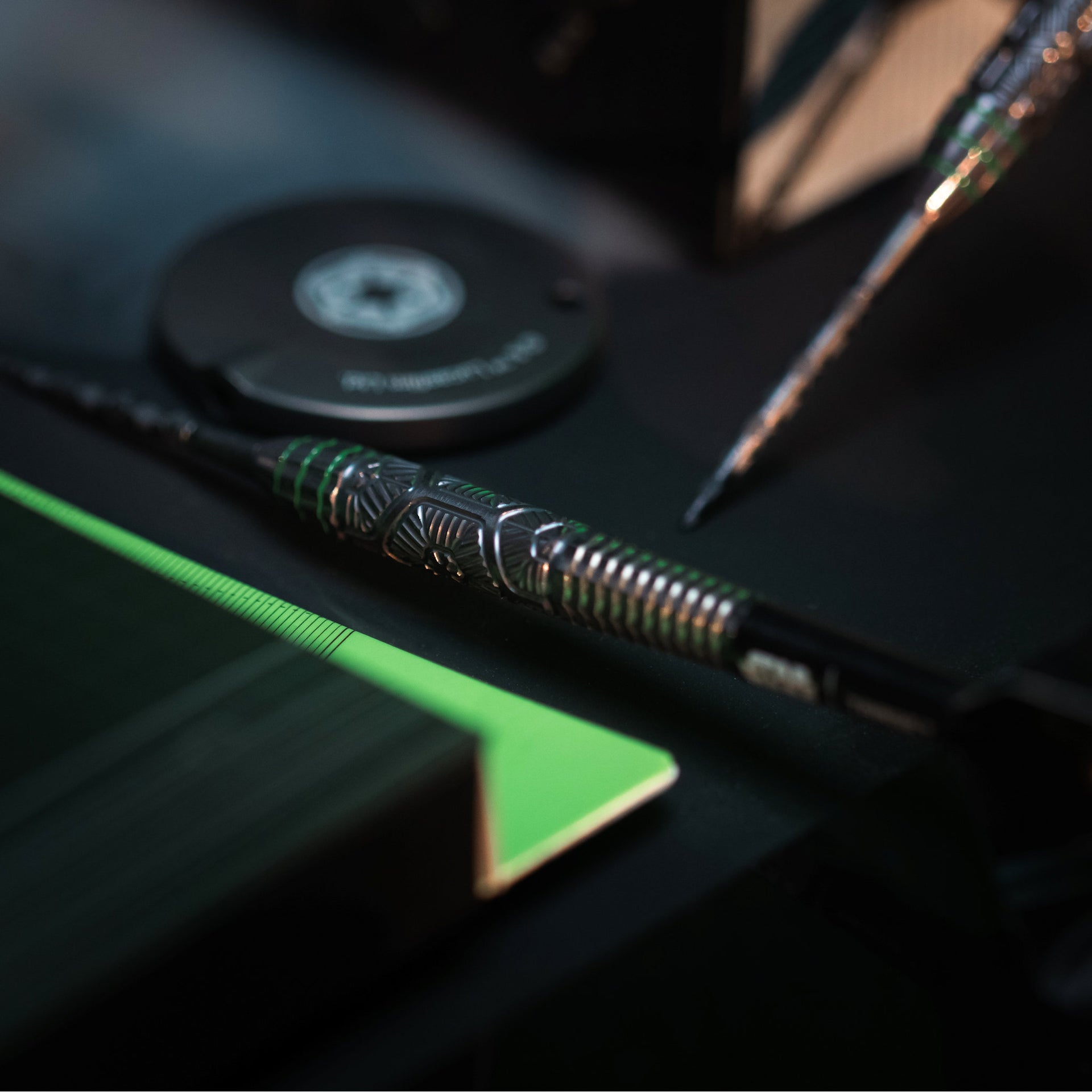 Close-up of a dart with decorative patterns on a blurred background Close-up of a dart with decorative patterns on a blurred background