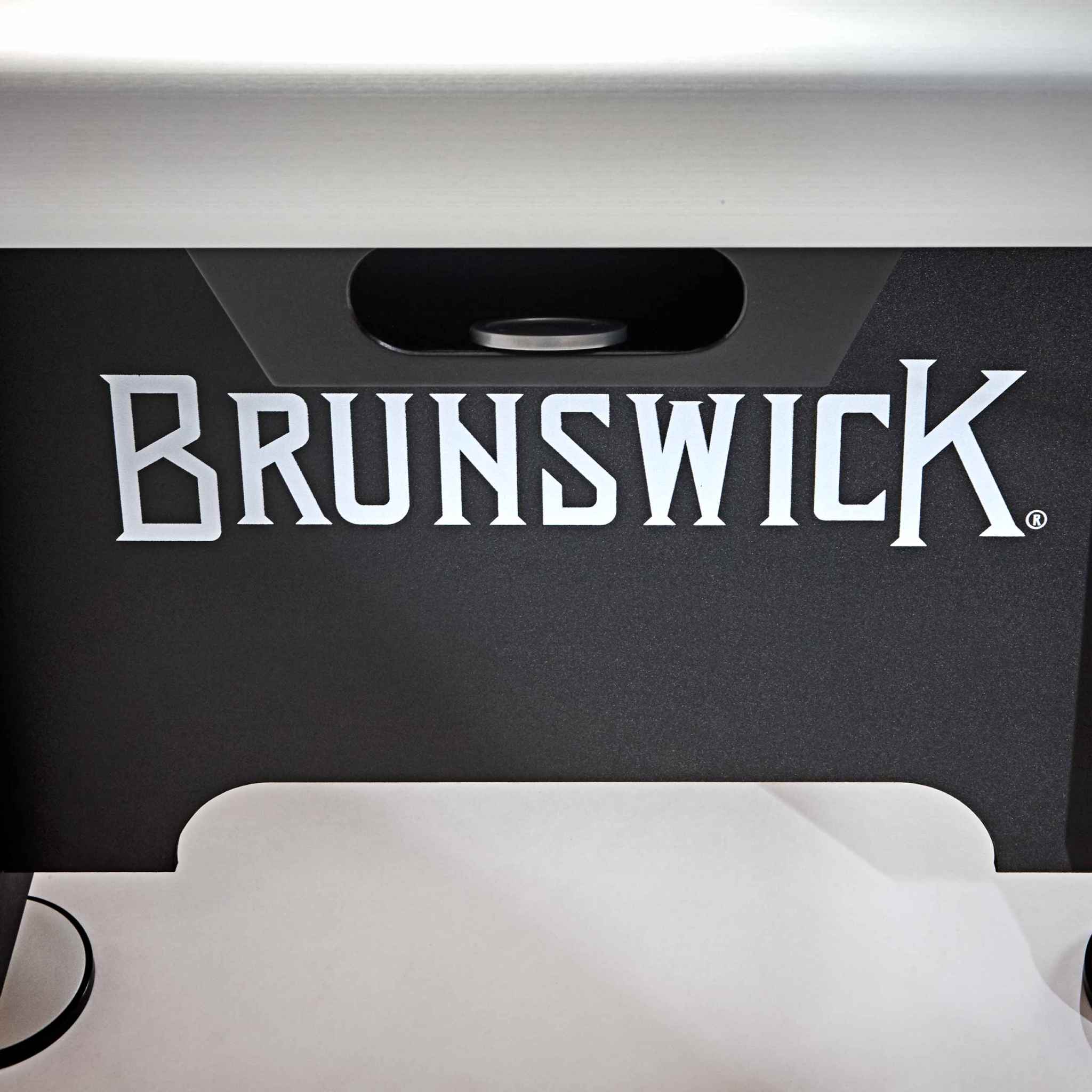 Close-up of Brunswick logo on 7' V-Force 2.0 Air Hockey table with sleek aluminum and black finish Close-up of Brunswick logo on 7' V-Force 2.0 Air Hockey table with sleek aluminum and black finish