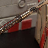 Close-up of a Target brand dart with a blurred background Close-up of a Target brand dart with a blurred background