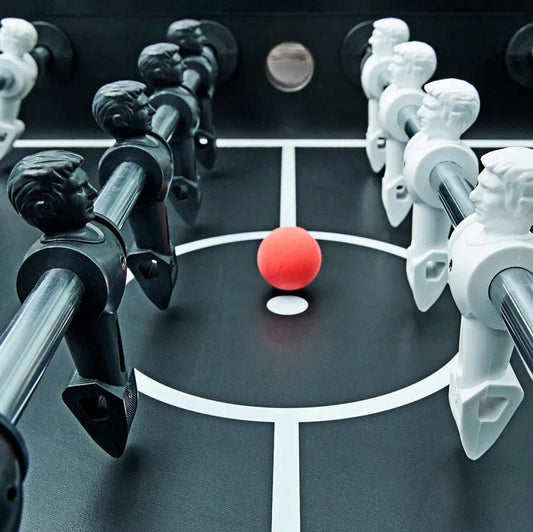 Modern home game room with pool, shuffleboard, and air hockey tables