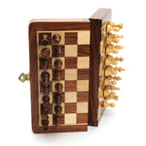 Folding 12"  Magnetic Chess Set by WE shown partial folded with the magnetic pieces hanging on 