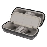 Gray earbud case with open lid showing earbuds inside on a white background