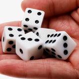 Liar's Dice + 10 Dice Games close up of dice in a hand.