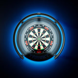 A Target Corona Vision 2 Light with a glowing blue surround and illuminated target face, centered on a dark blue background. The board has black, white, red, and green scoring sections with the brand name TARGET visible near the center and bottom.