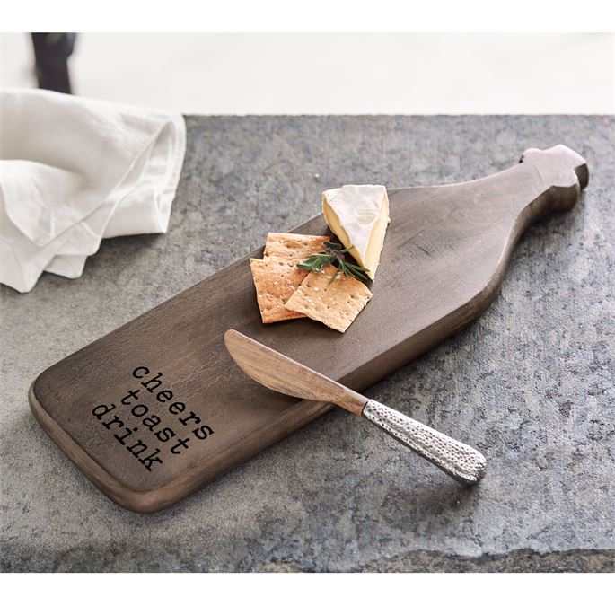 Mango wood bar board with "cheers toast drink" text, cheese, crackers, and spreader with hammered metal handle