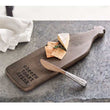 Mango wood bar board with "cheers toast drink" text, cheese, crackers, and spreader with hammered metal handle