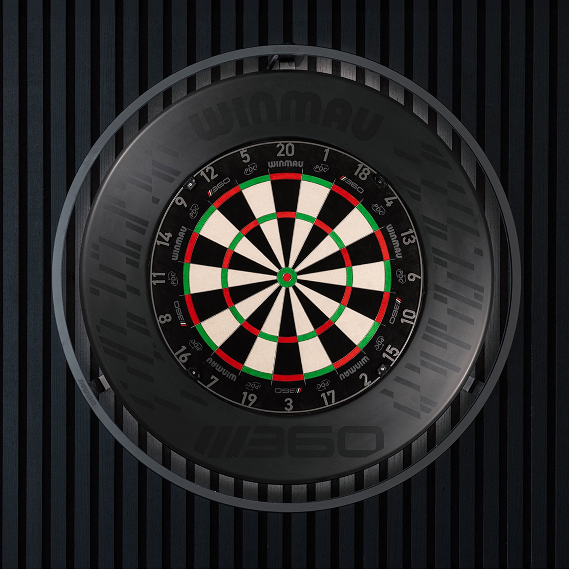 Dartboard with a black and white design on a dark textured background