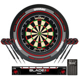 Winmau Blade 6 dartboard, surround with darts and accessories on a white background