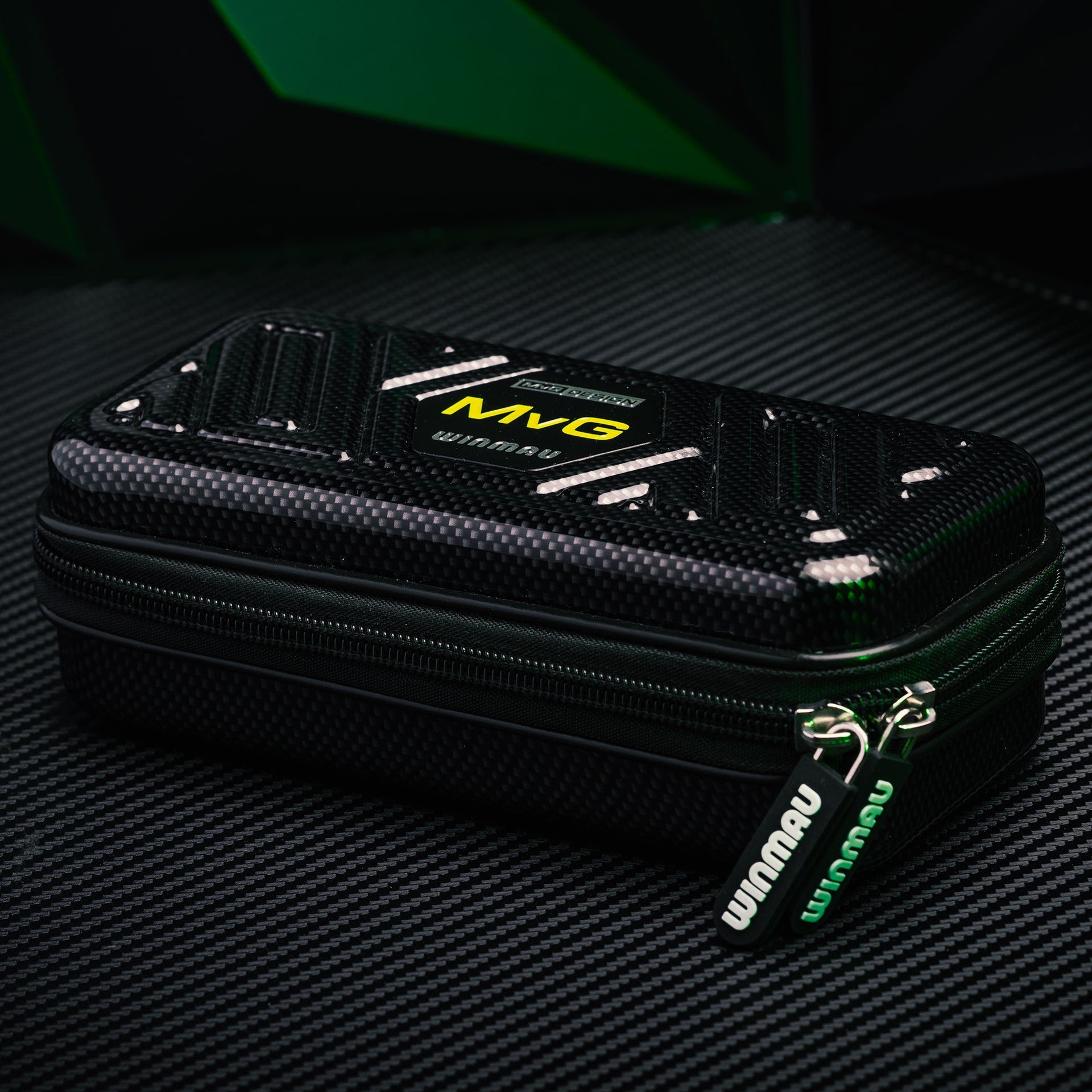 Black carrying case with 'Winmau' branding on a dark textured background