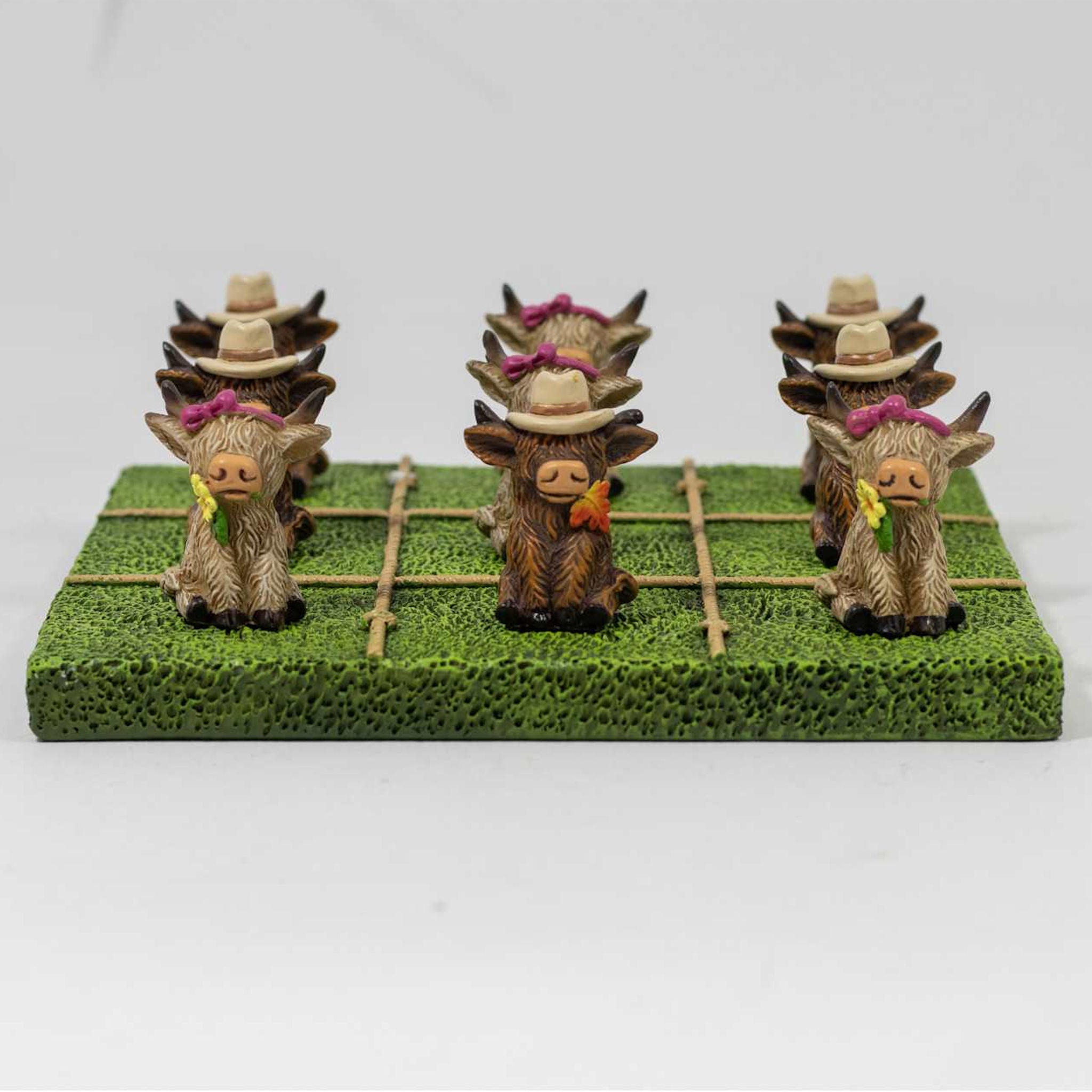 Tic Tac Toe Game Set Highland Cows shown on green playfield