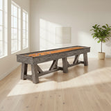 Botanic Charcoal Wooden shuffleboard table in a room with large windows and a plant.