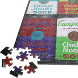 Puzzle with pieces shaped like Campbell's Chicken Noodle Soup cans