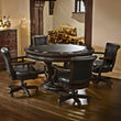 Brunswick Centennial Game Table set with four black leather chairs in a cozy room setting