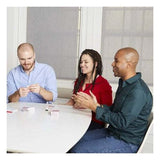 People playing The Chicken Or The Egg trivia card game at a table with timer and score pad