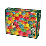 Cobble Hill Lime in the Coconut 1000-piece puzzle featuring colorful drink umbrellas and a hidden lime and coconut design