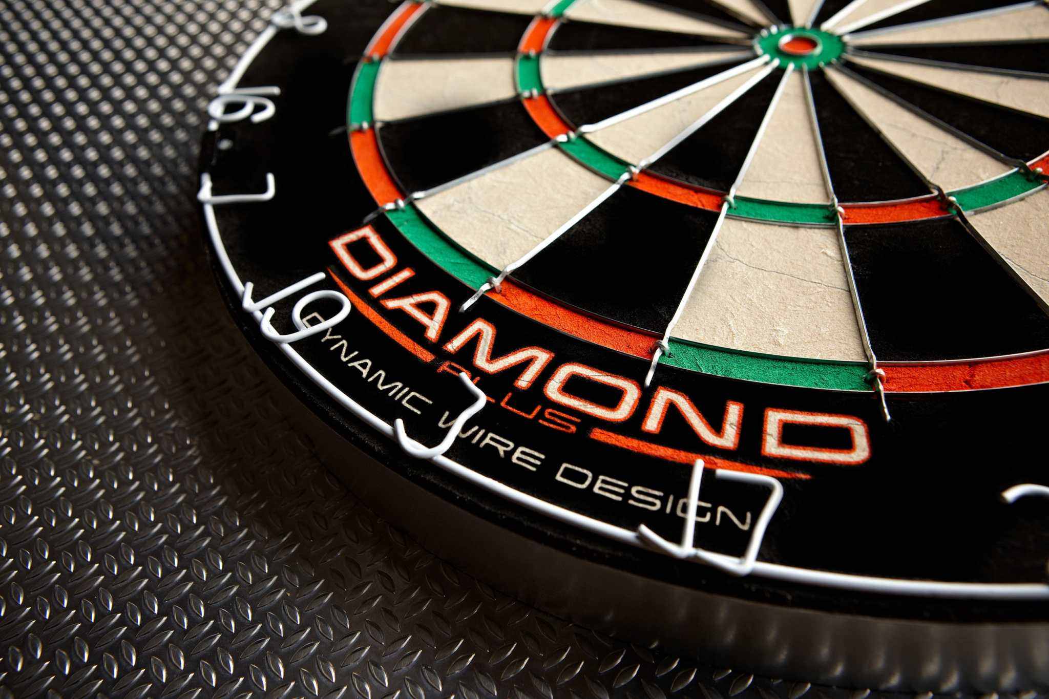 Close-up of Winmau Diamond Plus dartboard with refined wiring system and vibrant scoring segments