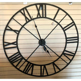 Industrial-inspired Wall Clock 48" close up on wall