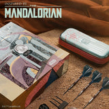 Product packaging inspired by 'The Mandalorian' with darts and case on a textured surface.
