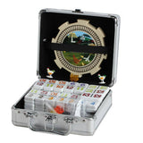 A silver metal carrying case containing a set of mahjong tiles, shown open against a white background. The case has a black interior with a decorative train track and chicken design, and the tiles are arranged in compartments.