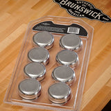 Brunswick Shuffleboard Rocks chrome-plated steel weights in plastic tray on wooden shuffleboard table