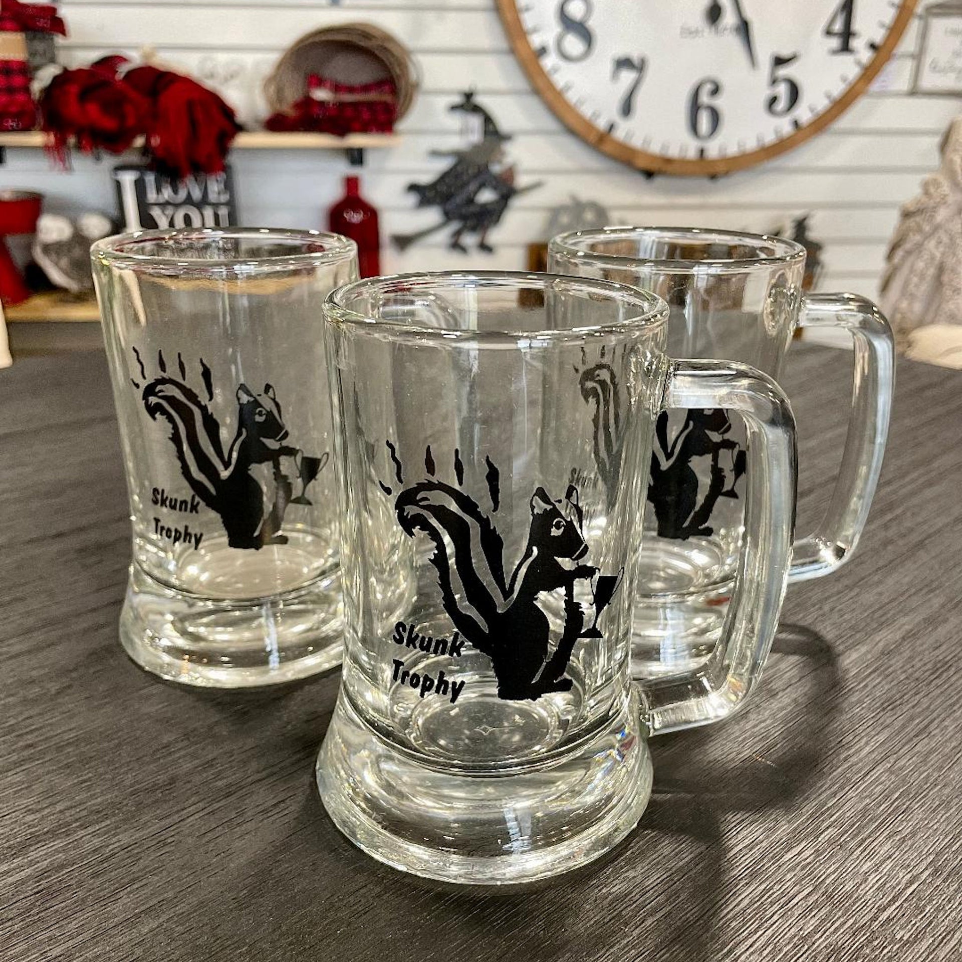 Glassware- Beer Stein Skunk Trophy in group setting
