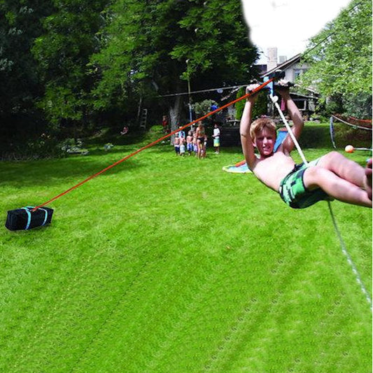 Slackers Zipline Deluxe Bungee Brake Kit showing child on the zipline with brake in the background