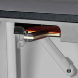 Close-up of Smash 7.0 table tennis paddle stored under black table tennis table with sturdy white support frame