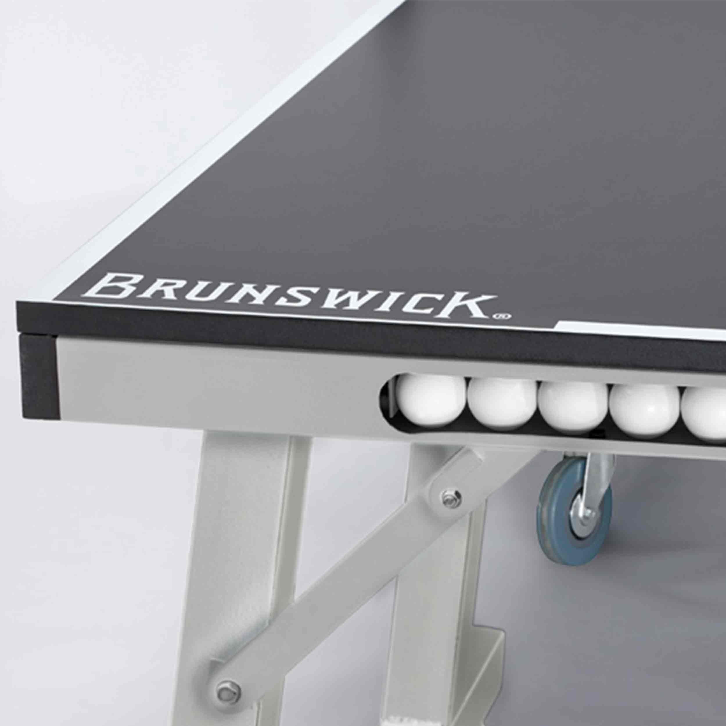 Black Smash 7.0 table tennis table with sturdy frame, ball storage, and caster wheels for easy mobility