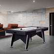7-foot Wind Chill Air Hockey table with sleek black pedestal base, dual embedded scorers, UL blower motor, mallets, and pucks in modern game room setting