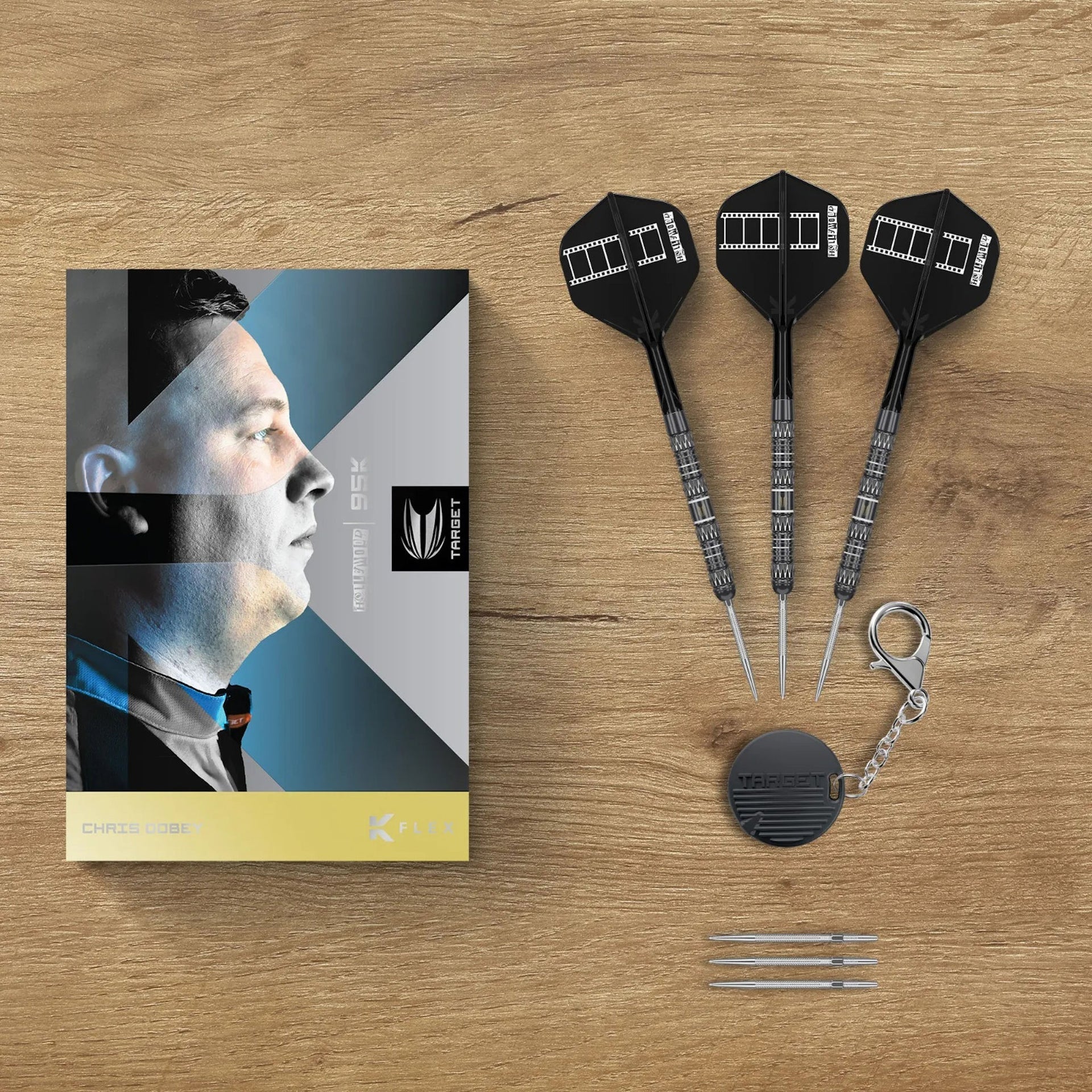 Chris Dobey 95K SP 95% Tungsten Dart set with packaging on a wooden surface