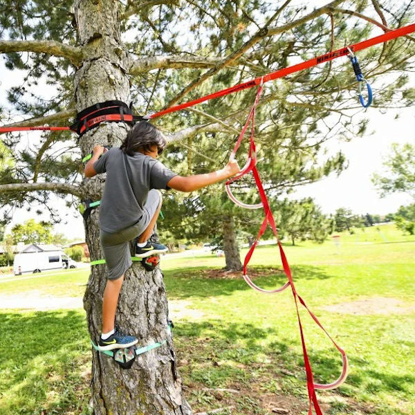 Slackers Tree Climbers Kit boy using the climbing kit